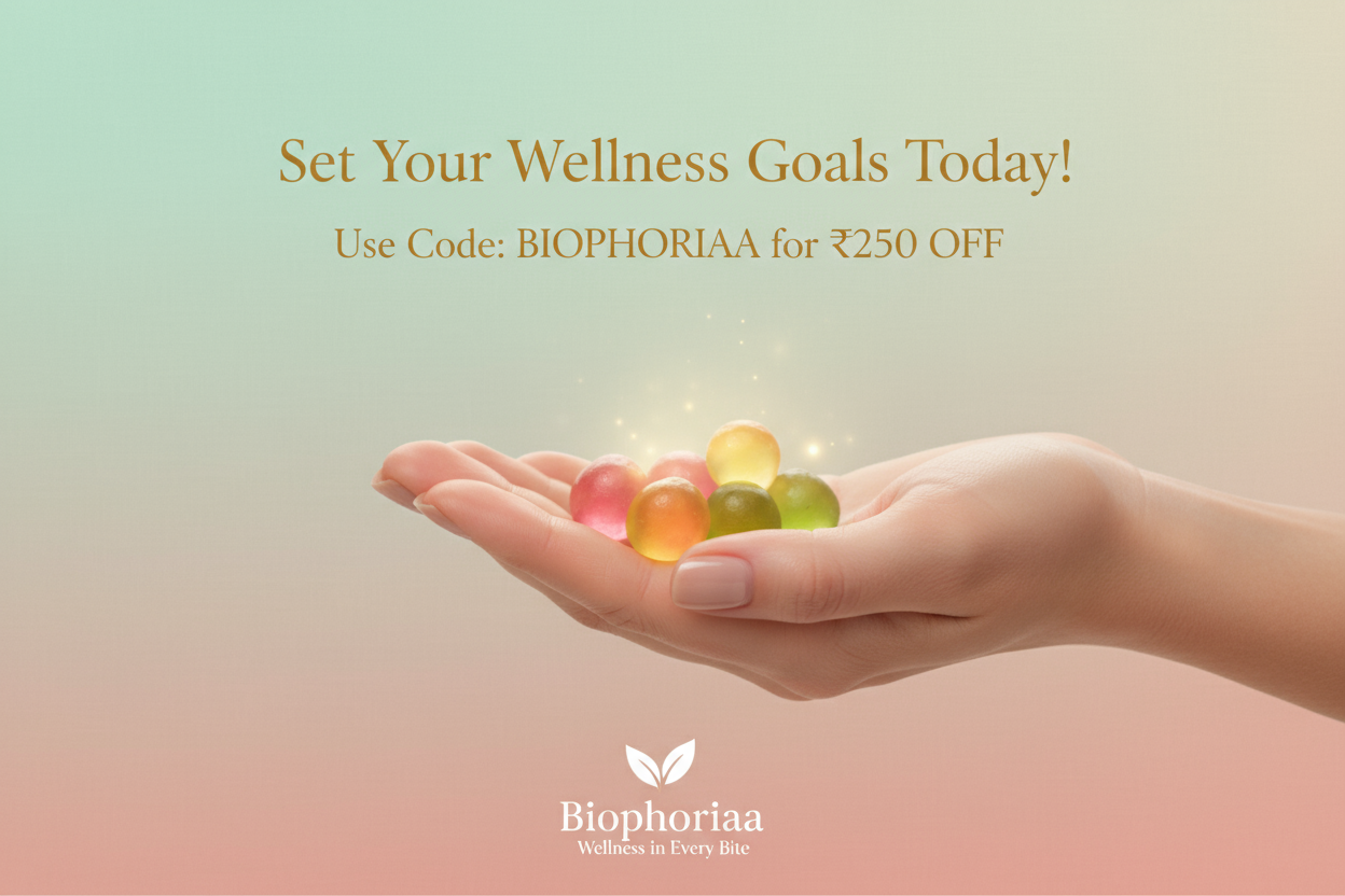 A premium and modern promotional banner showing a close-up of a hand holding colorful wellness gummies with a soft glow effect. The background is minimal and luxurious, in pastel tones (mint, blush, or beige) symbolizing wellness and positivity. Elegant typography displays the text: “Set Your Wellness Goals Today!” and “Use Code: BIOPHORIAA for ₹250 OFF”. Include subtle branding with the Biophoriaa logo at the bottom, and the tagline “Wellness in Every Bite.” The design should look aesthetic, clean, and sui